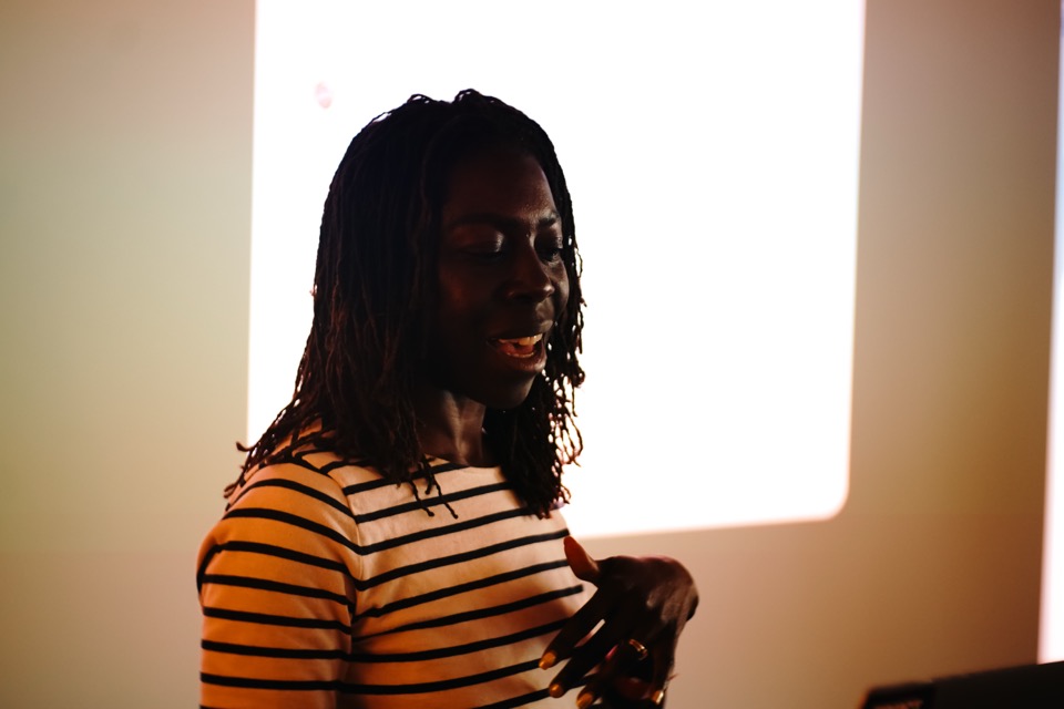 A speaker addressing attendees during a live Light School AI session